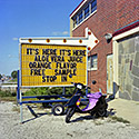 Changing Chicago Project: Roll 19 Neg 06 It's Here It's Here Sign, University Park IL 10.06.87 - Photograph by Jay Boersma