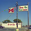 Changing Chicago Project: Roll 25 Neg 06 Stop & Go Food & Liquor, South Chicago Heights 10.23.87 - Photograph by Jay Boersma